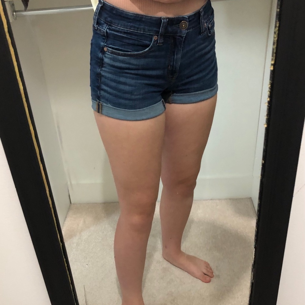 AE super stretch midi dark denim shorts.